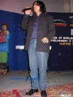 Ahmed Jahanzeb singing a song in school function