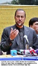 Babar Awan addressing a press conference