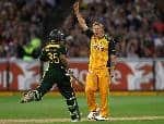 Shane Watson picks up Khalid Latif with some help from the umpire.jpg